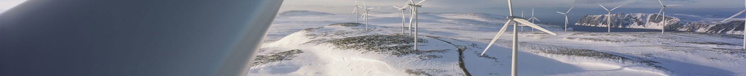Wind turbine in snow-covered landscape